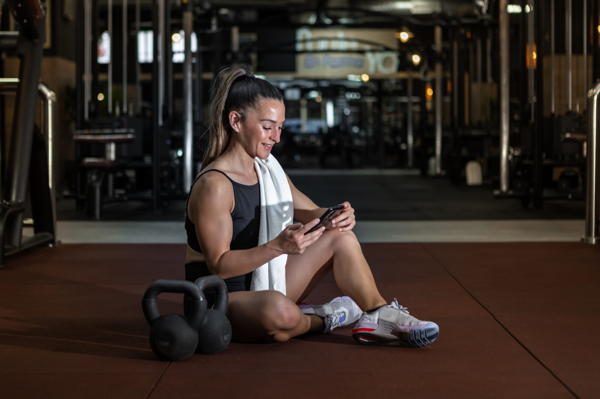 Website maintenance - woman using mobile phone after workout