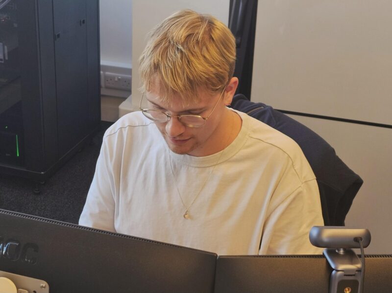 Tom working in the office at S2F during his internship experience